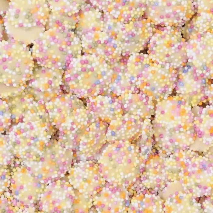 White chocolate with colorful candy sprinkles on top, crunchy texture, small round shape, ideal for sweet treats - SKU: Snowies200g